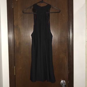 Black mini dress with lace straps.